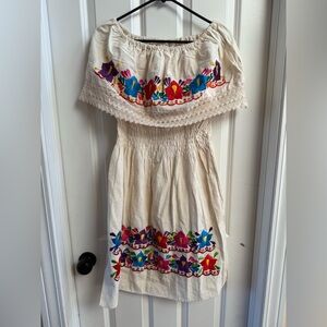 traditional Mexican off-the-shoulder dress colorful embroidered floral design